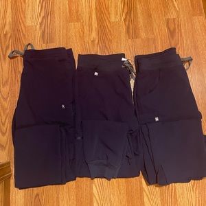 3 M Navy FIGS pants in Yola, Zamora, and Kade